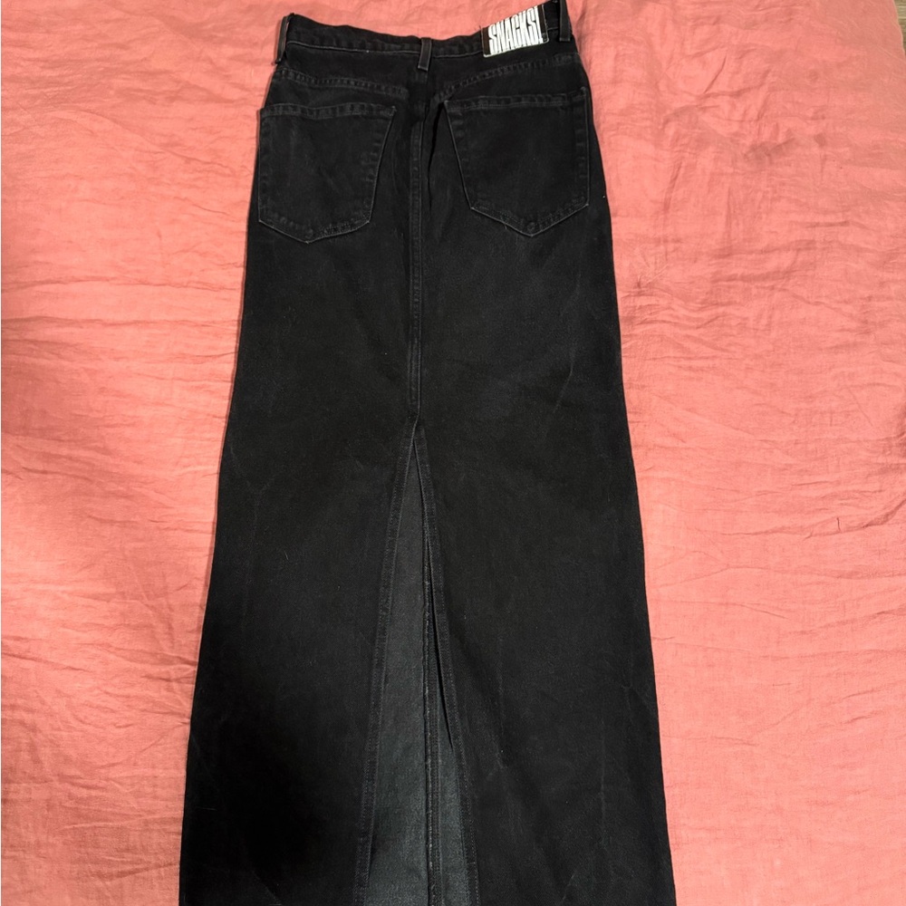 Black Maxi Snack Mother Jean Skirt with a back slit.